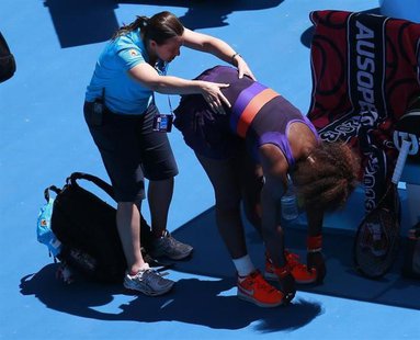 Serena Williams of the U.S. receives treatment during a medical timeout in her women's singles quarter-final match against compatriot Sloane Serena Williams of the U.S. receives treatment during a medical timeout in her women's singles quarter-final match against compatriot Sloane