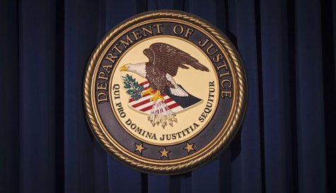 The Department of Justice (DOJ) logo is pictured on a wall after a news conference to discuss alleged fraud by Russian Diplomats in New York The Department of Justice (DOJ) logo is pictured on a wall after a news conference to discuss alleged fraud by Russian Diplomats in New York