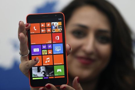 A model displays the Lumia 1320 smartphone during its launch in Abu Dhabi October 22, 2013. REUTERS/Ben Job A model displays the Lumia 1320 smartphone during its launch in Abu Dhabi October 22, 2013. REUTERS/Ben Job