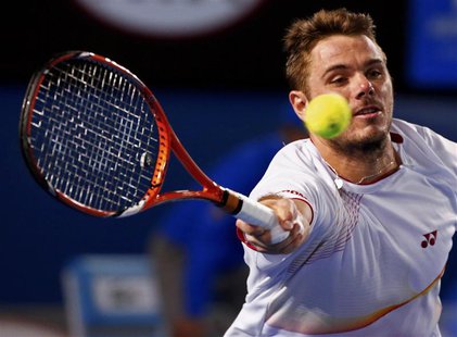 Stanislas Wawrinka of Switzerland hits a return to Tomas Berdych of the Czech Republic during their men's singles semi-final match at the Au Stanislas Wawrinka of Switzerland hits a return to Tomas Berdych of the Czech Republic during their men's singles semi-final match at the Au