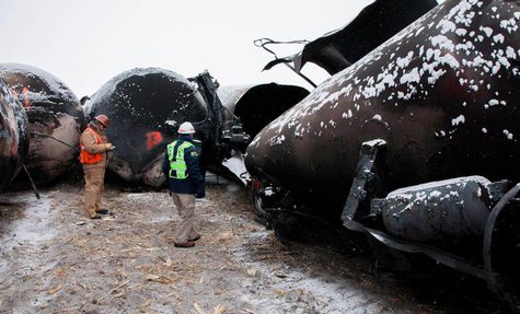 National Transporation and Safety Board (NTSB) member Robert Sumwalt (R) views damaged rail cars at the scene of the BNSF train accident in National Transporation and Safety Board (NTSB) member Robert Sumwalt (R) views damaged rail cars at the scene of the BNSF train accident in