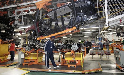 Chrysler auto assembly workers work on the line assembling Jeep Grand Cherokees and Dodge Durangos at the Chrysler Jefferson North Assembly Chrysler auto assembly workers work on the line assembling Jeep Grand Cherokees and Dodge Durangos at the Chrysler Jefferson North Assembly