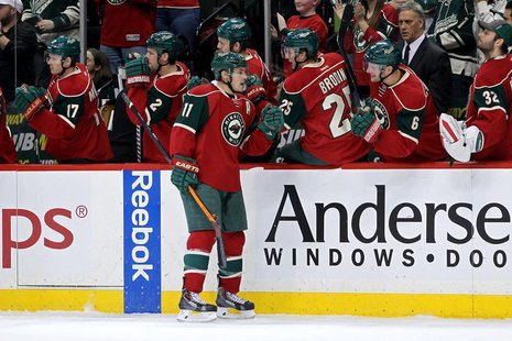 Dec 17, 2013; Saint Paul, MN, USA; Minnesota Wild forward Zach Parise (11) celebrates his goal with teammates during the first period agains Dec 17, 2013; Saint Paul, MN, USA; Minnesota Wild forward Zach Parise (11) celebrates his goal with teammates during the first period agains