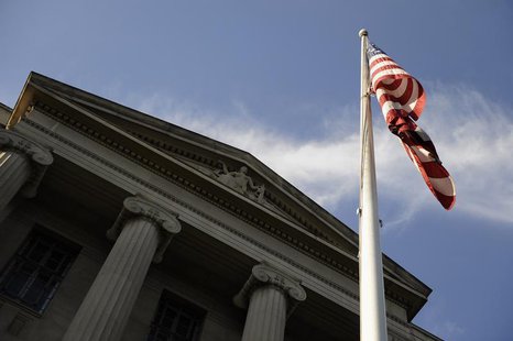 A US flag flies outside the U.S. Department of Justice headquarters building in Washington, July 14, 2009. REUTERS/Jonathan Ernst A US flag flies outside the U.S. Department of Justice headquarters building in Washington, July 14, 2009. REUTERS/Jonathan Ernst