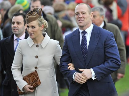 Britain's Zara Phillips (L) and her husband Mike Tindall walk to St. Mary's church to attend the annual Christmas service on the Royal Estat Britain's Zara Phillips (L) and her husband Mike Tindall walk to St. Mary's church to attend the annual Christmas service on the Royal Estat