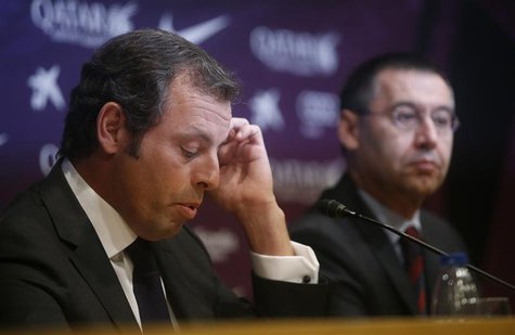 Barcelona president Sandro Rosell (L) attends a news conference where he announced his resignation, next to vice-president Josep Maria Barto Barcelona president Sandro Rosell (L) attends a news conference where he announced his resignation, next to vice-president Josep Maria Barto
