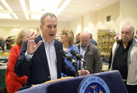 New York Attorney General Eric Schneiderman speaks to reporters during the New Eastcoast Arms Collectors Associates Arms Fair at the Saratog New York Attorney General Eric Schneiderman speaks to reporters during the New Eastcoast Arms Collectors Associates Arms Fair at the Saratog