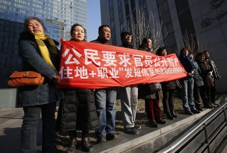 Supporters of Xu Zhiyong, one of China's most prominent rights advocates, shout slogans near a court where Xu's trial is being held, in Beij Supporters of Xu Zhiyong, one of China's most prominent rights advocates, shout slogans near a court where Xu's trial is being held, in Beij