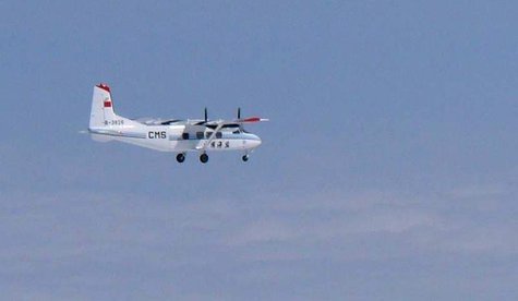 A Chinese government plane Y-12 flies about 120km (75 miles) north of the the disputed isles, known as Senkaku isles in Japan and Diaoyu isl A Chinese government plane Y-12 flies about 120km (75 miles) north of the the disputed isles, known as Senkaku isles in Japan and Diaoyu isl