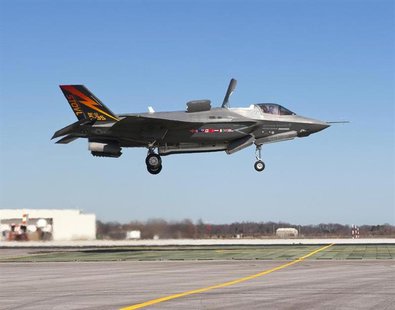 The supersonic Lockheed Martin F-35B Lightning II stealth fighter, piloted by Graham Tomlinson, lands vertically for the first time at Naval The supersonic Lockheed Martin F-35B Lightning II stealth fighter, piloted by Graham Tomlinson, lands vertically for the first time at Naval