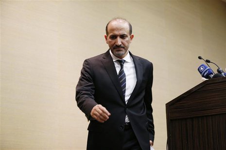 Syrian opposition leader Ahmed Jarba leaves a news conference in Geneva January 23, 2014. REUTERS/Jamal Saidi Syrian opposition leader Ahmed Jarba leaves a news conference in Geneva January 23, 2014. REUTERS/Jamal Saidi
