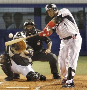 Tokyo Yakult Swallows' Wladimir Balentien hits his 56th homer to break Japan's single-season, off Hanshin Tigers' Daiki Enokida in the first Tokyo Yakult Swallows' Wladimir Balentien hits his 56th homer to break Japan's single-season, off Hanshin Tigers' Daiki Enokida in the first