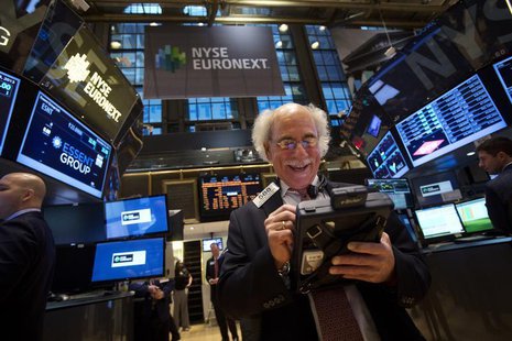 Trader Peter Tuchman smiles as he works on the floor of the New York Stock Exchange after the market opening in New York, December 23, 2013. Trader Peter Tuchman smiles as he works on the floor of the New York Stock Exchange after the market opening in New York, December 23, 2013.