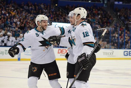 Jan 18, 2014; Tampa, FL, USA; San Jose Sharks defenseman Jason Demers (5), center Patrick Marleau (12) and defenseman Marc-Edouard Vlasic (4 Jan 18, 2014; Tampa, FL, USA; San Jose Sharks defenseman Jason Demers (5), center Patrick Marleau (12) and defenseman Marc-Edouard Vlasic (4