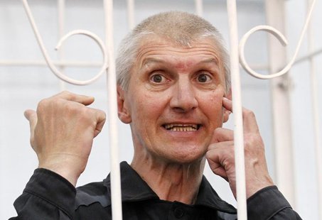 Platon Lebedev, jailed business partner of Russian ex-tycoon Mikhail Khodorkovsky, gestures after hearing the verdict inside the defendants' Platon Lebedev, jailed business partner of Russian ex-tycoon Mikhail Khodorkovsky, gestures after hearing the verdict inside the defendants'