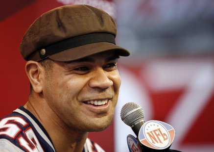New England Patriots' Junior Seau answers questions during media day for the National Football League's (NFL) Super Bowl XLII in Glendale, A New England Patriots' Junior Seau answers questions during media day for the National Football League's (NFL) Super Bowl XLII in Glendale, A