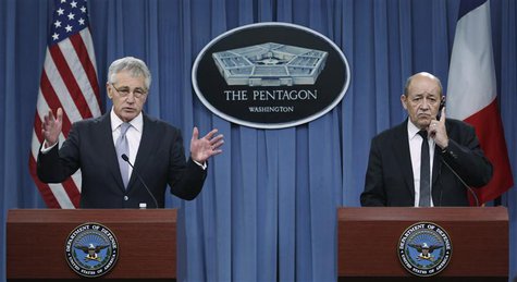 U.S. Secretary of Defense Chuck Hagel (L) and French Minister of Defense Jean-Yves Le Drian conduct a joint news conference after their meet U.S. Secretary of Defense Chuck Hagel (L) and French Minister of Defense Jean-Yves Le Drian conduct a joint news conference after their meet
