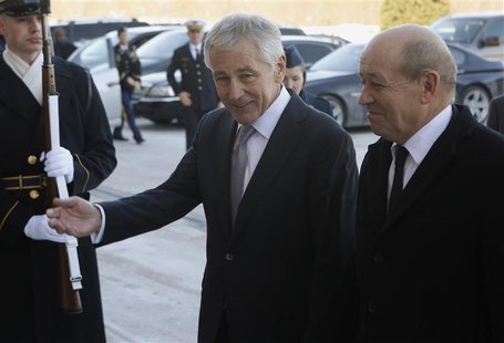U.S. Secretary of Defense Chuck Hagel (L) welcomes French Minister of Defense Jean-Yves Le Drian before their meeting at the Pentagon in Was U.S. Secretary of Defense Chuck Hagel (L) welcomes French Minister of Defense Jean-Yves Le Drian before their meeting at the Pentagon in Was