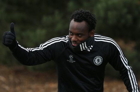 Michael Essien of Chelsea gives a thumbs up as he arrives for a team training session at their training facility in Stoke D'Abernon, south o Michael Essien of Chelsea gives a thumbs up as he arrives for a team training session at their training facility in Stoke D'Abernon, south o