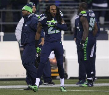 Seattle Seahawks cornerback Richard Sherman taunts San Francisco 49ers players during the fourth quarter in the NFL's NFC Championship footb Seattle Seahawks cornerback Richard Sherman taunts San Francisco 49ers players during the fourth quarter in the NFL's NFC Championship footb