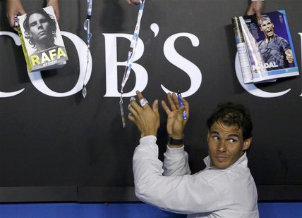 Rafael Nadal of Spain signs autographs after defeating Roger Federer of Switzerland in their men's singles semi-final match at the Australia Rafael Nadal of Spain signs autographs after defeating Roger Federer of Switzerland in their men's singles semi-final match at the Australia
