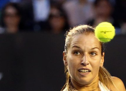Dominika Cibulkova of Slovakia watches the ball as she hits a return to Li Na of China during their women's singles final match at the Austr Dominika Cibulkova of Slovakia watches the ball as she hits a return to Li Na of China during their women's singles final match at the Austr