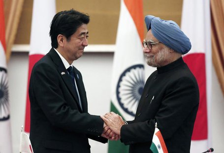 Japan's Prime Minister Shinzo Abe (L) and his Indian counterpart Manmohan Singh shake hands after addressing the media at Hyderabad House in Japan's Prime Minister Shinzo Abe (L) and his Indian counterpart Manmohan Singh shake hands after addressing the media at Hyderabad House in