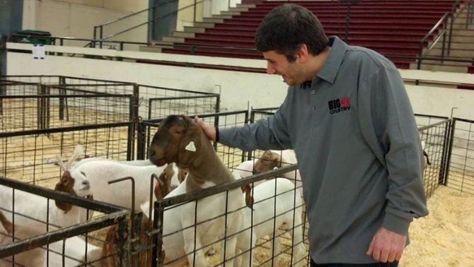 Robbie and a goat brainstorm ideas for his show