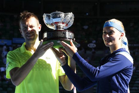 Kristina Mladenovic of France and Daniel Nestor of Canada pose with the trophy after defeating Horia Tecau of Romania and Sania Mirza of Ind Kristina Mladenovic of France and Daniel Nestor of Canada pose with the trophy after defeating Horia Tecau of Romania and Sania Mirza of Ind