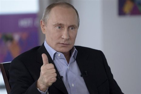 Russian President Vladimir Putin answers a journalist's question during a televised news conference in Sochi January 19, 2014. REUTERS/Alexe Russian President Vladimir Putin answers a journalist's question during a televised news conference in Sochi January 19, 2014. REUTERS/Alexe