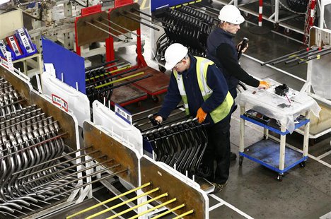 Workers inspect components on the fuel inlet production facility at Futaba Industrial in Foston, central England in this January 21, 2014 fi Workers inspect components on the fuel inlet production facility at Futaba Industrial in Foston, central England in this January 21, 2014 fi