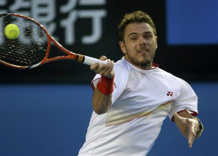 Stanislas Wawrinka of Switzerland hits a return to Rafael Nadal of Spain during their men's singles final match at the Australian Open 2014 Stanislas Wawrinka of Switzerland hits a return to Rafael Nadal of Spain during their men's singles final match at the Australian Open 2014