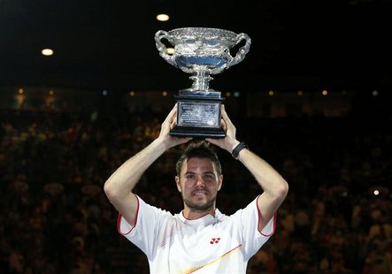 Stanislas Wawrinka of Switzerland poses with the Norman Brookes Challenge Cup after defeating Rafael Nadal of Spain in their men's singles f Stanislas Wawrinka of Switzerland poses with the Norman Brookes Challenge Cup after defeating Rafael Nadal of Spain in their men's singles f