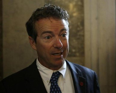 Senator Rand Paul (R-KY) speaks to the media before his party's working lunch on Capitol Hill in Washington October 8, 2013. REUTERS/Gary Ca Senator Rand Paul (R-KY) speaks to the media before his party's working lunch on Capitol Hill in Washington October 8, 2013. REUTERS/Gary Ca