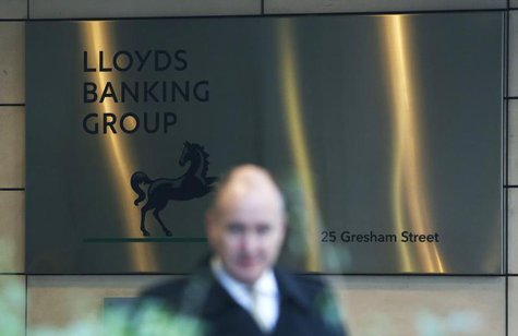 A man walks past the entrance to the head office of Lloyds Banking Group in the City of London December 11, 2013. REUTERS/Olivia Harris A man walks past the entrance to the head office of Lloyds Banking Group in the City of London December 11, 2013. REUTERS/Olivia Harris