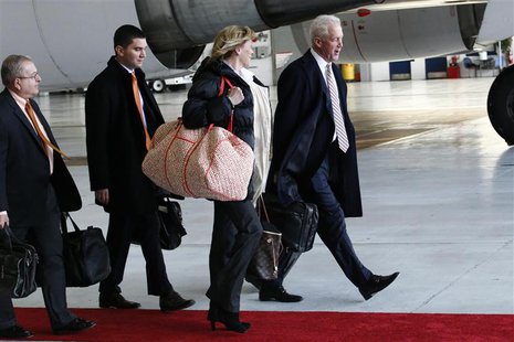 Denver Broncos head coach John Fox (R) speaks with members of the team as they arrive at the Newark International Airport to finish off thei Denver Broncos head coach John Fox (R) speaks with members of the team as they arrive at the Newark International Airport to finish off thei