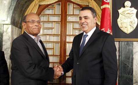 Tunisian President Moncef Marzouki (L) shakes hands with Tunisia's Prime Minister-designate Mehdi Jomaa after Jomaa spoke during a news conf Tunisian President Moncef Marzouki (L) shakes hands with Tunisia's Prime Minister-designate Mehdi Jomaa after Jomaa spoke during a news conf