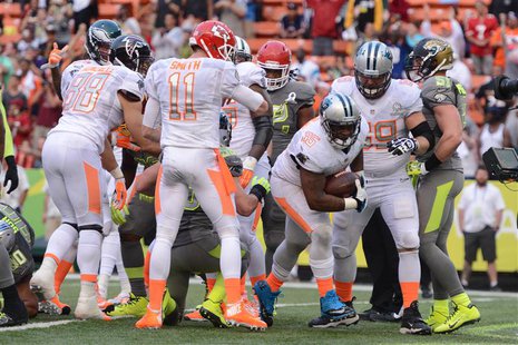 January 26, 2014; Honolulu, HI, USA; Team Rice fullback Mike Tolbert of the Carolina Panthers (35) scores the game-winning two-point convers January 26, 2014; Honolulu, HI, USA; Team Rice fullback Mike Tolbert of the Carolina Panthers (35) scores the game-winning two-point convers