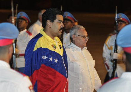 Venezuela's President Nicolas Maduro (centre L) walks with Cuba's Minister of Higher Education Rodolfo Alarcon Ortiz upon arrival at the Jos Venezuela's President Nicolas Maduro (centre L) walks with Cuba's Minister of Higher Education Rodolfo Alarcon Ortiz upon arrival at the Jos