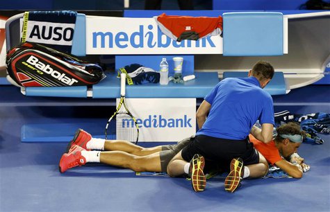 Rafael Nadal of Spain receives treatment during his men's singles final match against Stanislas Wawrinka of Switzerland at the Australian Op Rafael Nadal of Spain receives treatment during his men's singles final match against Stanislas Wawrinka of Switzerland at the Australian Op