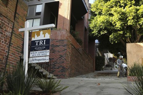 A man stands near a sign advertising a home for sale in the Pacific Heights neighborhood in San Francisco, California October 25, 2013.Rober A man stands near a sign advertising a home for sale in the Pacific Heights neighborhood in San Francisco, California October 25, 2013.Rober