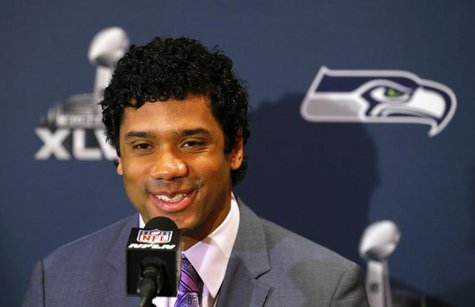 Seattle Seahawks quarterback Russell Wilson speaks during a news conference after the team's arrival for Super Bowl XLVIII against the Denve Seattle Seahawks quarterback Russell Wilson speaks during a news conference after the team's arrival for Super Bowl XLVIII against the Denve