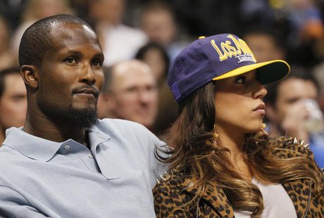 Denver Broncos cornerback Champ Bailey watches the Denver Nuggets play the Los Angeles Lakers with an unidentified woman in Game 4 of their Denver Broncos cornerback Champ Bailey watches the Denver Nuggets play the Los Angeles Lakers with an unidentified woman in Game 4 of their