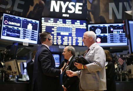 Traders work on the main trading floor of the New York Stock Exchange (NYSE) shortly after the opening bell in New York, May 20, 2013. REUTE Traders work on the main trading floor of the New York Stock Exchange (NYSE) shortly after the opening bell in New York, May 20, 2013. REUTE
