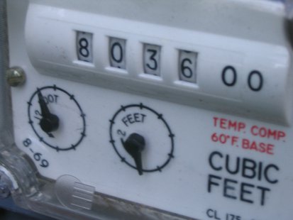 A residential gas meter. A residential gas meter.