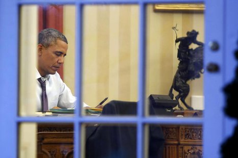 U.S. President Barack Obama sits inside the Oval Office with a pen in hand as he prepares for Tuesday night's State of the Union Address to U.S. President Barack Obama sits inside the Oval Office with a pen in hand as he prepares for Tuesday night's State of the Union Address to