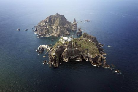 A set of remote islands called Dokdo in Korean and Takeshima in Japanese is seen in this picture taken from a helicopter carrying South Kore A set of remote islands called Dokdo in Korean and Takeshima in Japanese is seen in this picture taken from a helicopter carrying South Kore