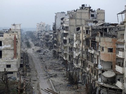 Damaged buildings line a street in the besieged area of Homs January 27, 2014. REUTERS/Yazan Homsy Damaged buildings line a street in the besieged area of Homs January 27, 2014. REUTERS/Yazan Homsy