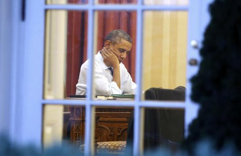 U.S. President Barack Obama sits inside the Oval Office as he prepares for Tuesday night's State of the Union Address to the nation on Capit U.S. President Barack Obama sits inside the Oval Office as he prepares for Tuesday night's State of the Union Address to the nation on Capit