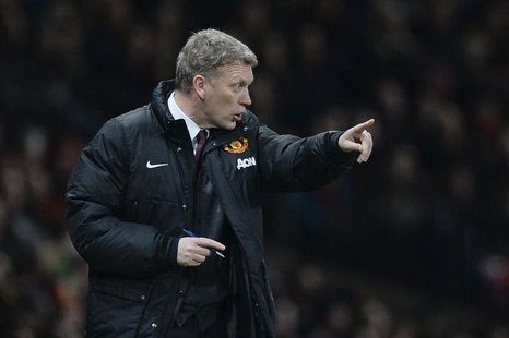 Manchester United's manager David Moyes gestures during their English League Cup semi-final second leg soccer match against Sunderland at Ol Manchester United's manager David Moyes gestures during their English League Cup semi-final second leg soccer match against Sunderland at Ol